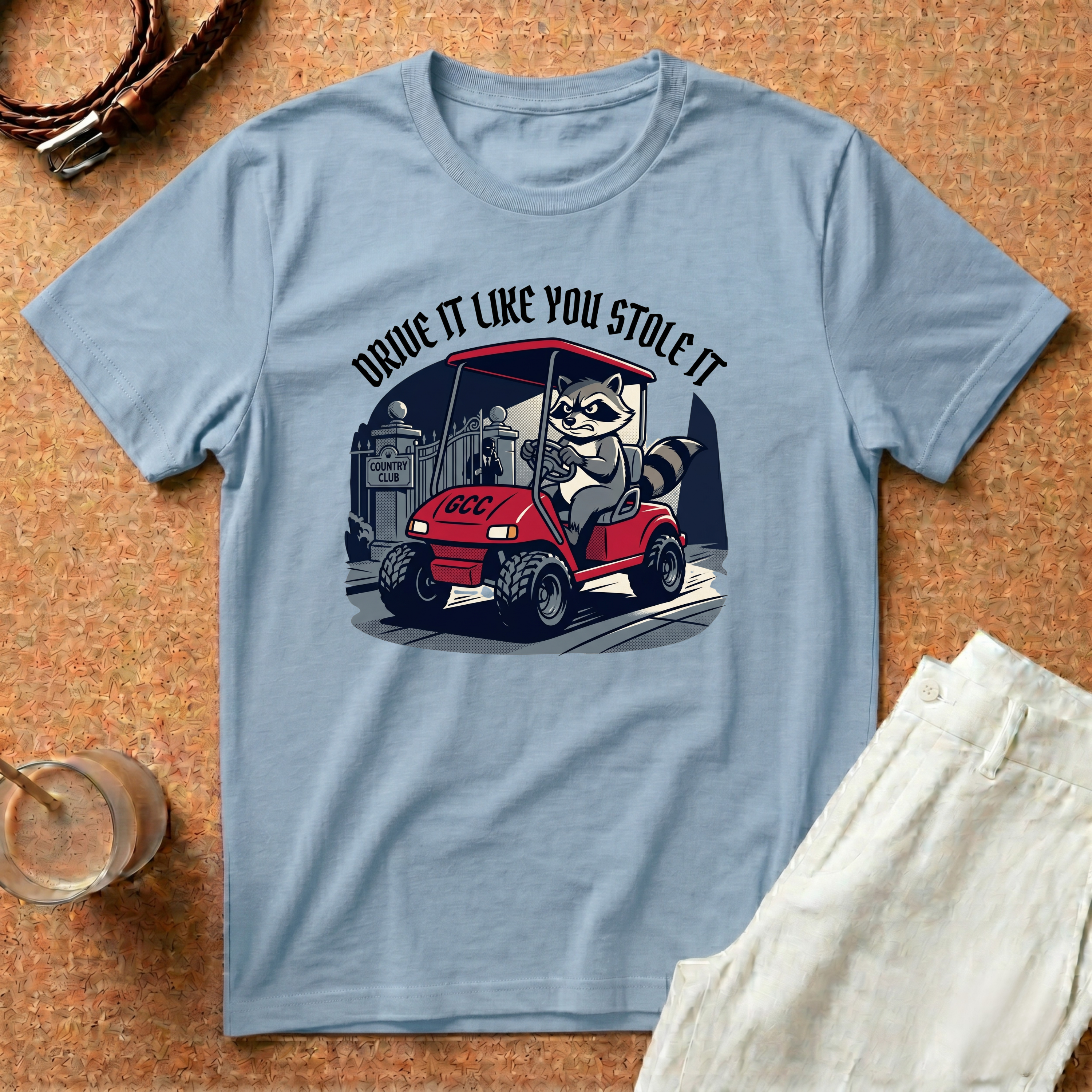 Drive It Like You Stole It T-Shirt — Raccoon Driving Golf Cart Graphic Tee