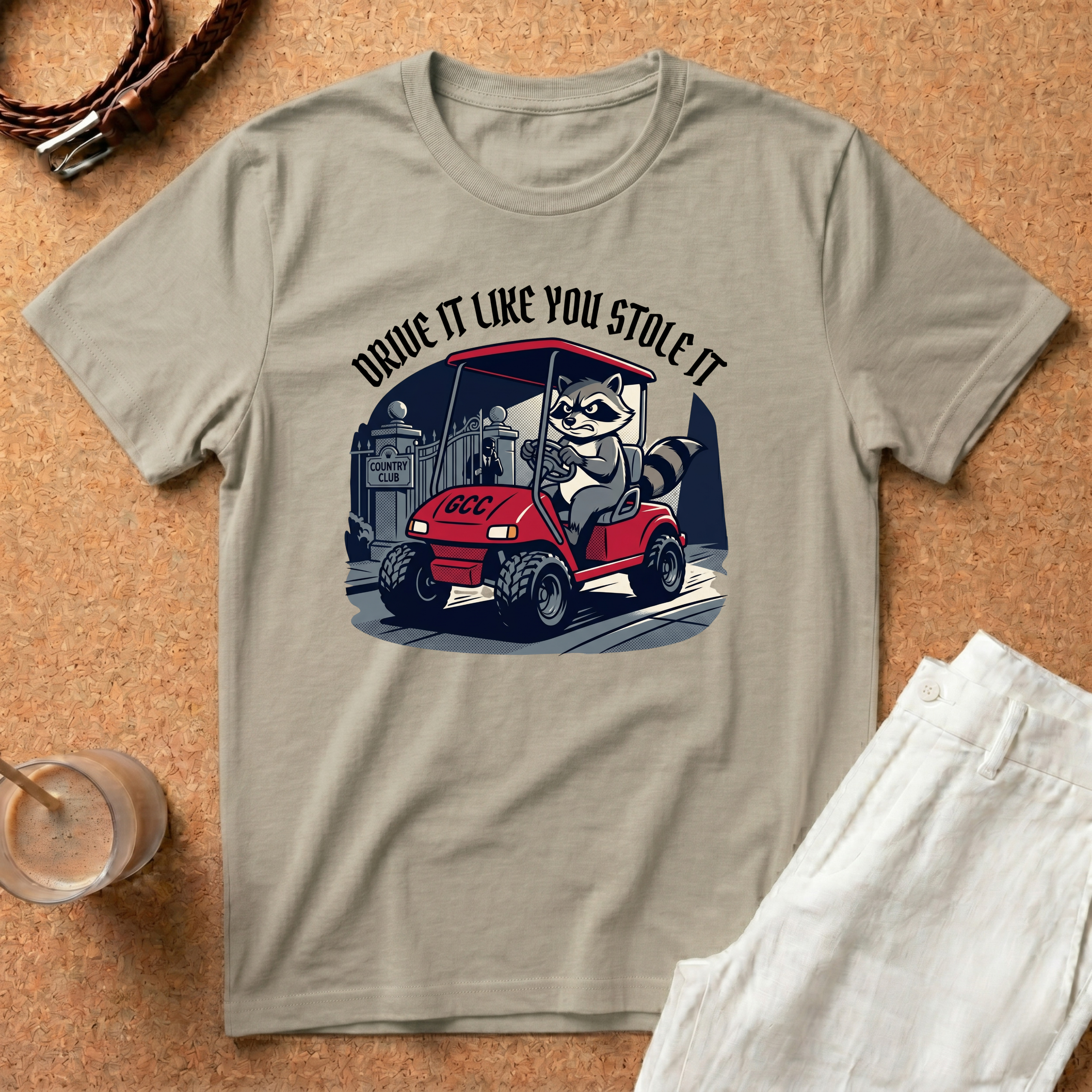 Drive It Like You Stole It T-Shirt — Raccoon Driving Golf Cart Graphic Tee