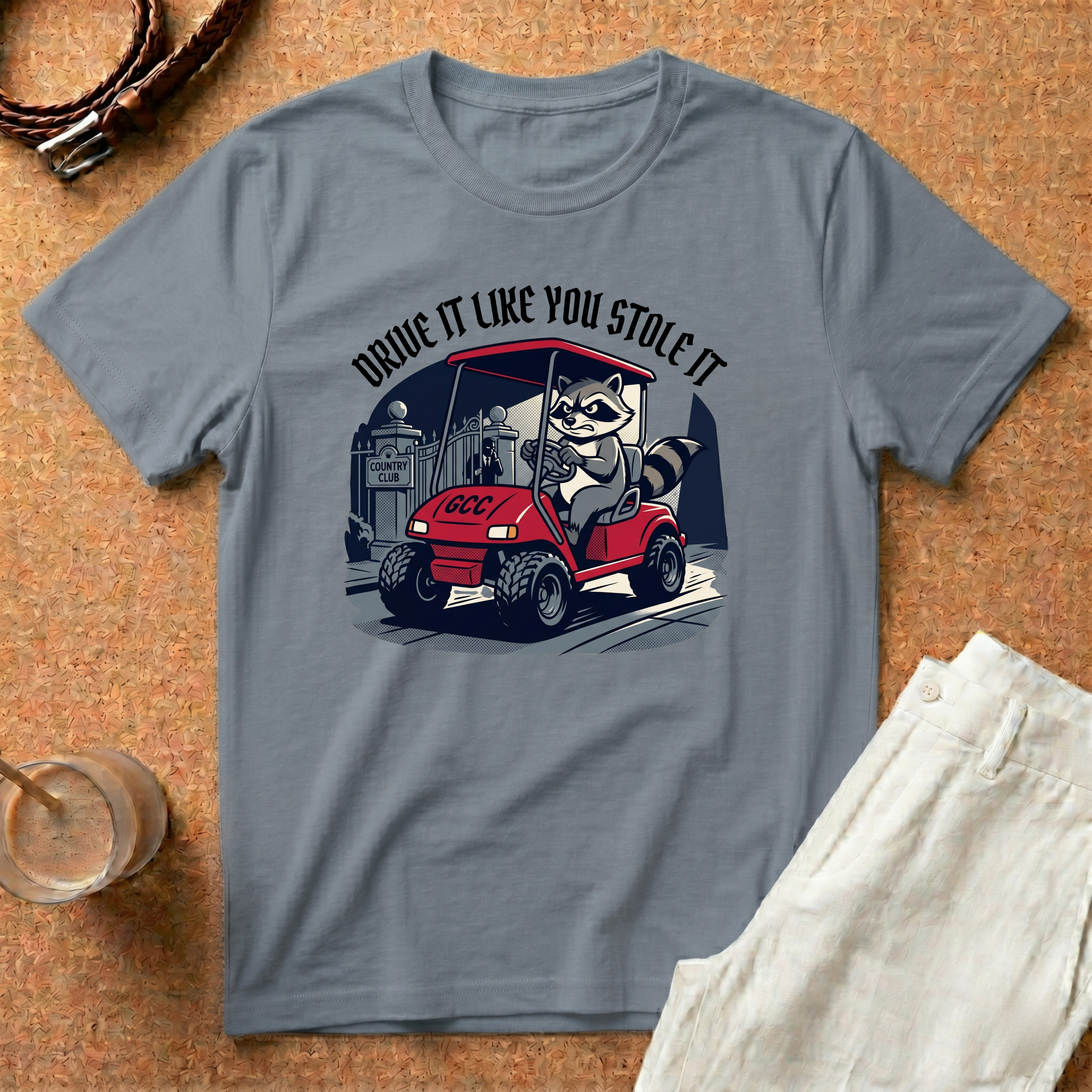 Drive It Like You Stole It T-Shirt — Raccoon Driving Golf Cart Graphic Tee